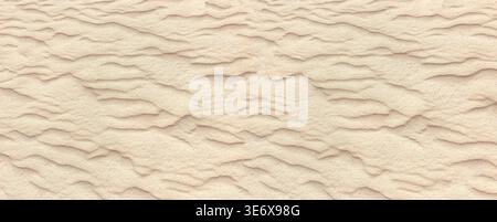 Desert sand showing textured ripples created by wind, forming natural patterns Stock Photo