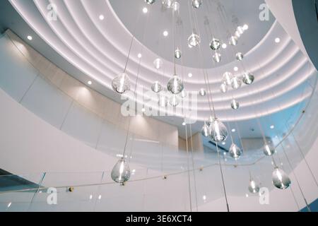 Contemporary Public Area Featuring Suspended Glass Spheres And Sleek Architectural Elements Stock Photo