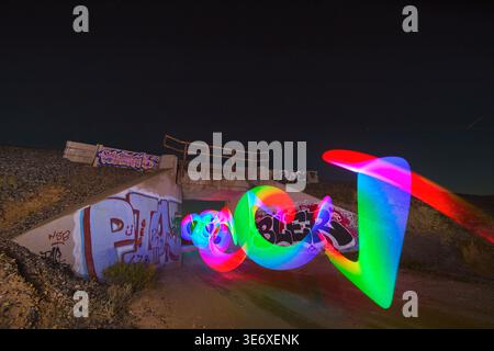 Light Painting and Graffiti Under Bridge at Night Blue Hour in Nevada Desert Stock Photo