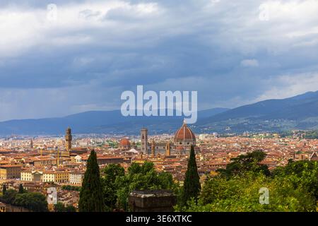 Scenic panoramic view of Florence historic city center with cathedral dome and stormy clouds above, Tuscany, Italy Stock Photo
