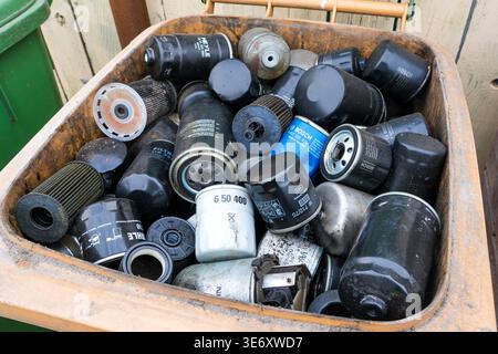Liepaja, Latvia- 29 March, 2026: Container filled with used oil filters, illustrating vehicle maintenance waste and recycling and disposal concepts Stock Photo