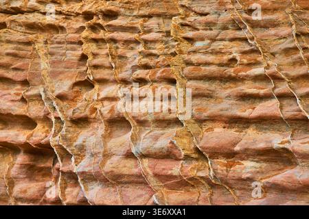 Rugged Rock Texture Close Up With Layered Pattern And Warm Earth Tones Stock Photo