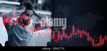 Man Shows Stress While Analyzing Stock Market Data in an Office Environment Stock Photo