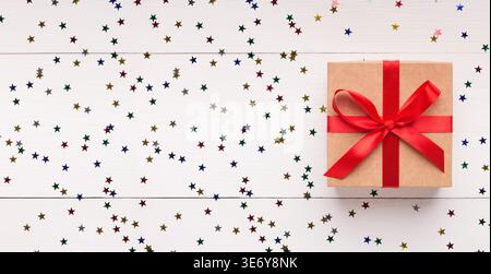 Brown gift box with red bow on white background Stock Photo