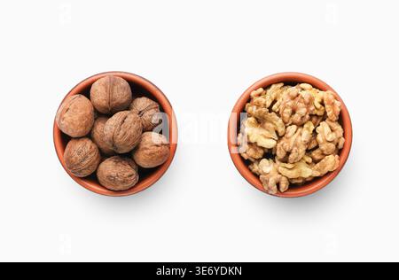 Bowls of peeled and unpeeled walnuts, top view Stock Photo