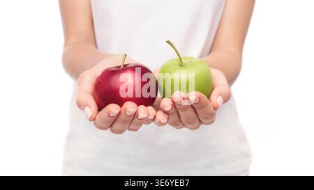 Woman offering two apples in her hands Stock Photo