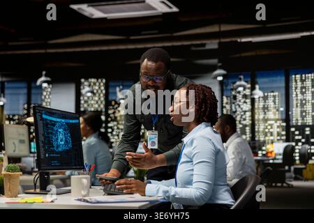 Business team of experts use AI big data and predictive analytics, checking smart work solutions and cloud computing for adaptive strategies. Artificial intelligence engineering algorithms. Stock Photo