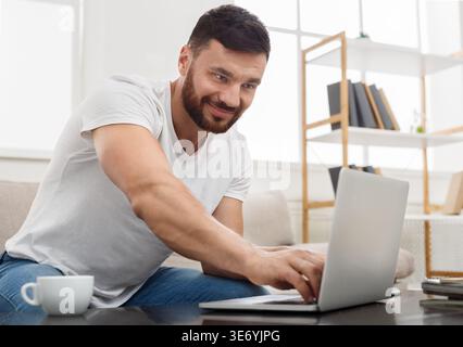 Successful entrepreneur working on laptop in home office. Stock Photo