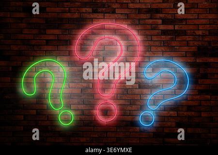 Three neon question marks on brick wall Stock Photo