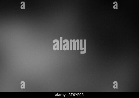 Grainy dark gradient background with soft light vignette and copy space Stock Photo