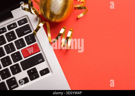 Computer notebook keyboard with icon shopping cart Stock Photo