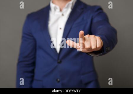 Businessman pushing button on blank virtual screen Stock Photo