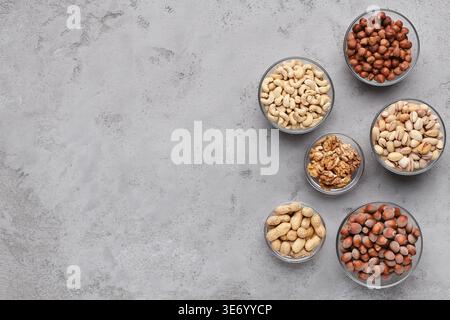 Assortment of nuts in glass bowls, top view Stock Photo