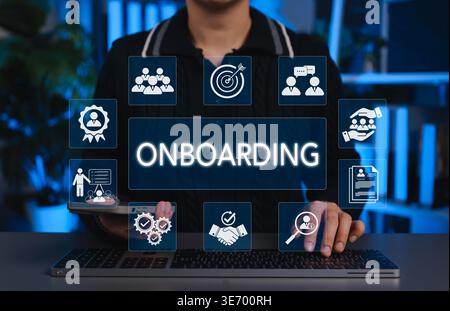 Employee Onboarding and Hiring Integration Concept. Person using laptop with onboarding, training, profile, teamwork, and verification icons. employee Stock Photo