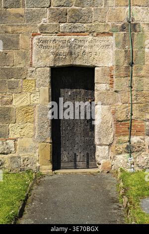 Old wooden door in church tower of St Oswalds parish church in market town of Oswestry Stock Photo