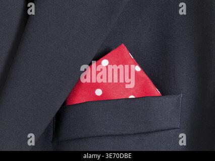 Folder linen handkerchiefs in red with white spots in top pocket of blazer Stock Photo