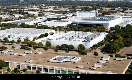 Aerial view showing large white buildings with many HVAC systems at a massive industrial park Stock Photo