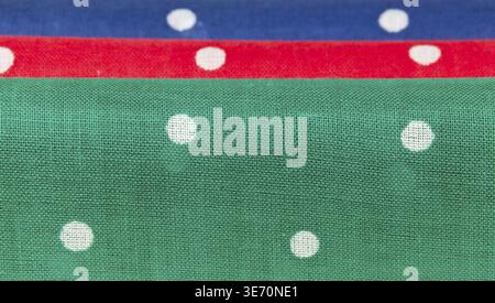 Folder linen handkerchiefs in red blue and green with white spots Stock Photo