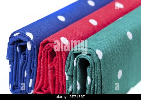 Folder linen handkerchiefs in red blue and green with white spots Stock Photo