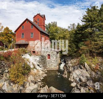 Side view of the Old Red Mill by the creek in Jericho Vermont during the fall Stock Photo