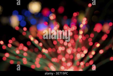 Defocused bokeh of christmas tree lights to be used as abstract background for holiday image Stock Photo