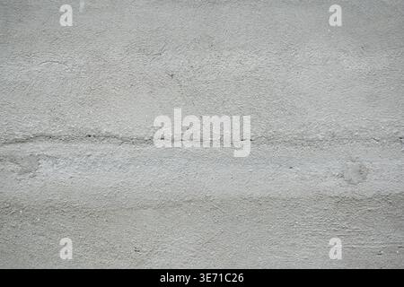 Gray concrete texture with horizontal crack minimal industrial background abstract cement surface neutral copy space Stock Photo