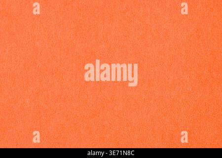 Vibrant orange textured paper background with soft grain pattern Stock Photo