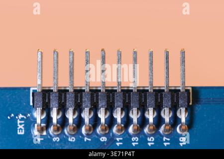 Pin header connector providing an electrical connection on a circuit board Stock Photo
