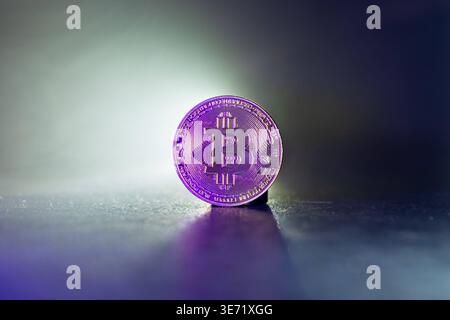 Bitcoin with Golden Glow Reflected on Surface Golden Bitcoin with Light Reflections moody Cryptocurrency Scen *** Bitcoin mit Golden Glow reflektiert Stock Photo