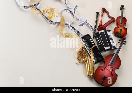 World music day. Musical instruments with flowing music note ribbons Stock Photo