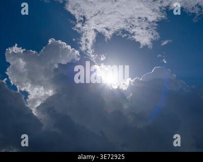 Dramatic storm clouds with backlit sun in Tuscany, Italy Stock Photo