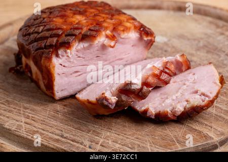 Baked Bavarian Leberkäse on light wood Stock Photo