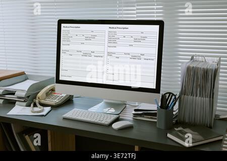 Medical Prescription Forms Displaying on Computer for Clinic Workflow Stock Photo