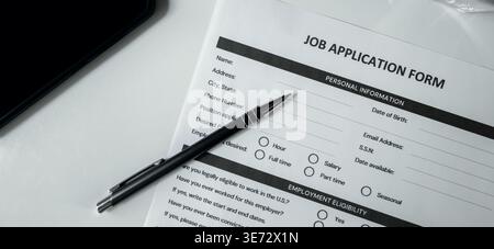 Job application form with pen on the table. Employment, hiring and recruitment agency concept Stock Photo