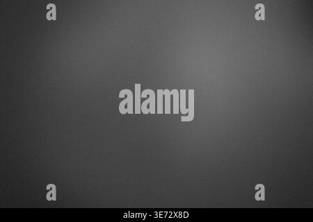 Grainy dark gradient background with soft light vignette and copy space Stock Photo