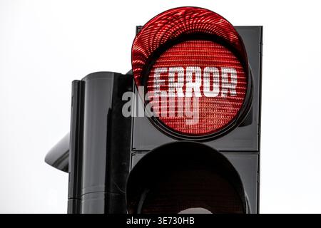 Close View Of Traffic Signal Displaying ERROR Text On Bright Red Light Stock Photo