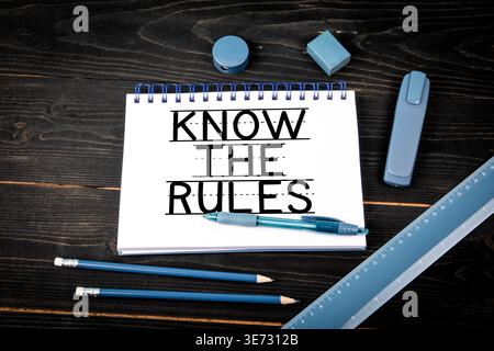 Know The Rules Written On Notebook Page With Pen And Ruler Stock Photo