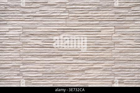 Bright facing with stone-effect on a facade Stock Photo
