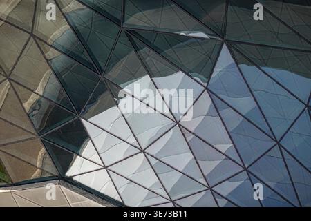 Facade detail of BMW Welt, architect COOP HIMMELB(L)AU, Munich, Bavaria, Germany, angular metal and glass panels with geometric triangular patterns Stock Photo