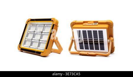 Portable battery lantern with handle and solar panel, functions as a power bank and lighting during power outage, isolated on white background. Stock Photo