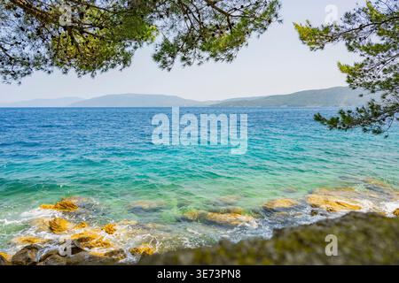 Romantic view over the sea on a sunny day with rough seas on the island of Cres, Croatia Stock Photo