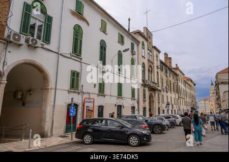 People walking down a street towards the harbour area of Split, Croatia. Stock Photo