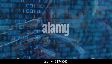 Leaning adult woman typing on laptop at desk, dark top, papers, binary overlay, copy space. Cybersecurity, data, code, programmer, analyst, workstatio Stock Photo