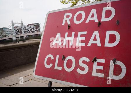 Following the decision by Kensington & Chelsea council to close the 150 year-old Albert Bridge to traffic - and also this week, to pedestrians and cyclists, a Road Ahead Closed sign is on northern embankment of the bridge, on 9th April 2026, in London, England. The Grade II listed Albert Bridge (1873) which connects Battersea to Chelsea has been closed to traffic as a precautionary measure following a routine structural inspection by engineers. The closure follows the similar closure of Hammersmith Bridge, therefore causing even more traffic disruption in west London. Stock Photo