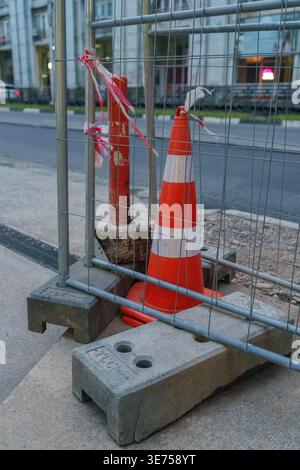 Orange Cones and Metal Barrier on Street Stock Photo