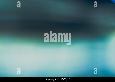 Abstract dark blue and teal blurry background with horizontal light streaks Stock Photo