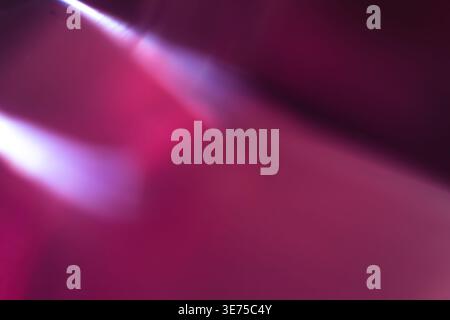 Vibrant magenta and purple abstract background with diagonal light flares Stock Photo