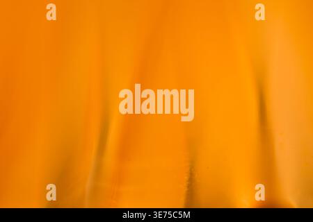 Rich orange abstract silk texture with soft waves and elegant lighting Stock Photo