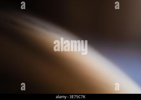 Abstract out of focus background with warm brown and dark grey tones Stock Photo