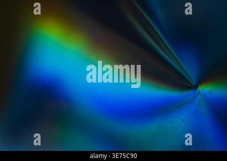 Futuristic blue and green prism light rays on dark background Stock Photo
